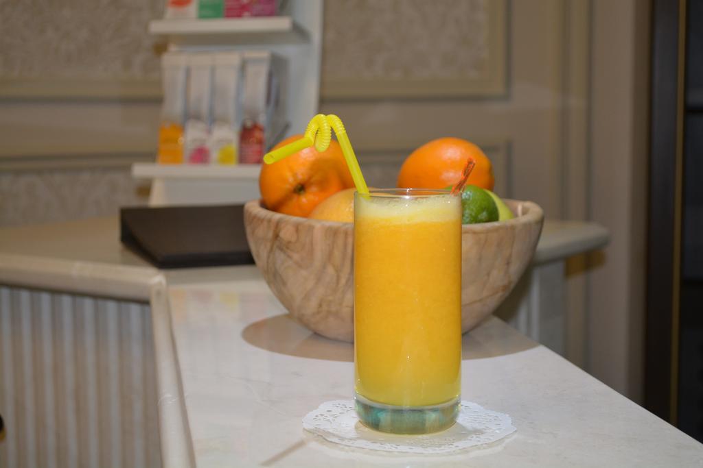 Rixos Khadisha Shymkent Hotel Eksteriør billede A glass of orange juice